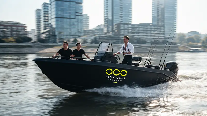 Matte-black OOO motorboat on the river
